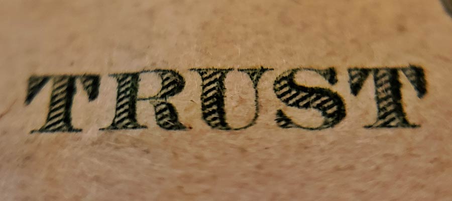 The word "TRUST" printed on currency.