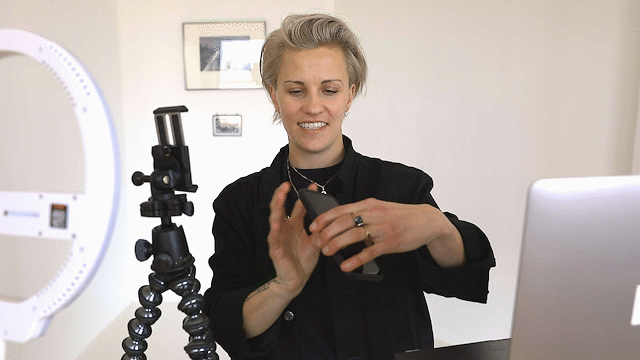 Placing smartphone on a tripod and testing earbuds