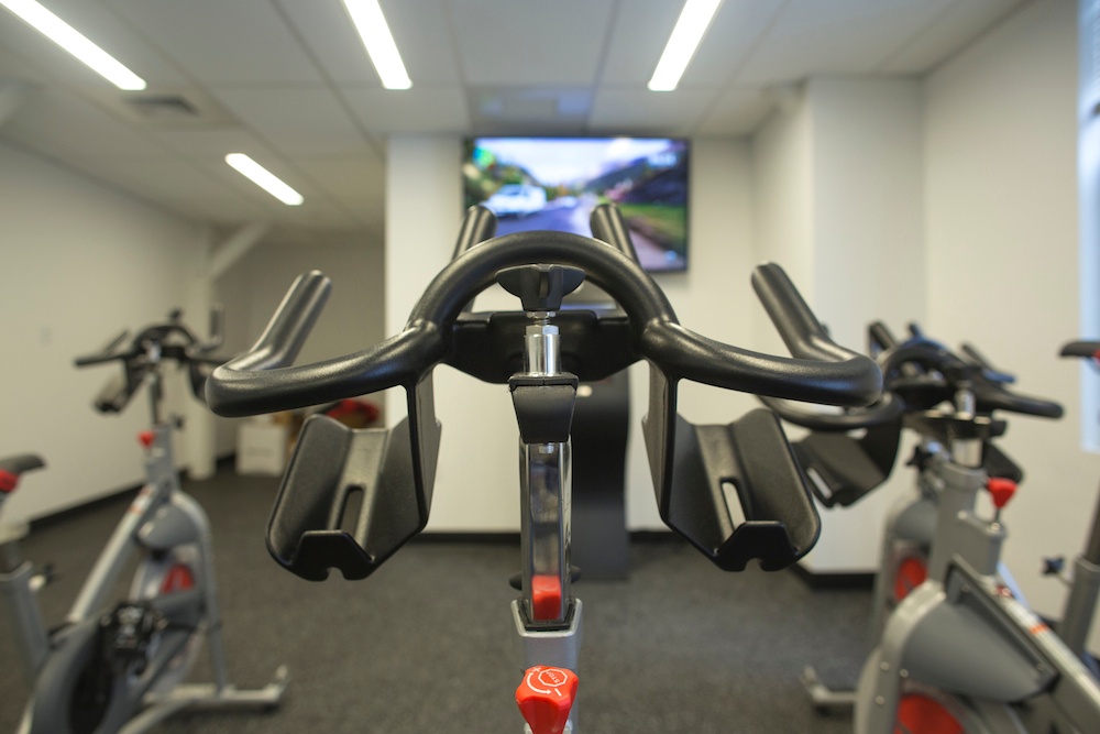 Picture of Hubspot's workplace gym, which emphasizes employee health and wellness.