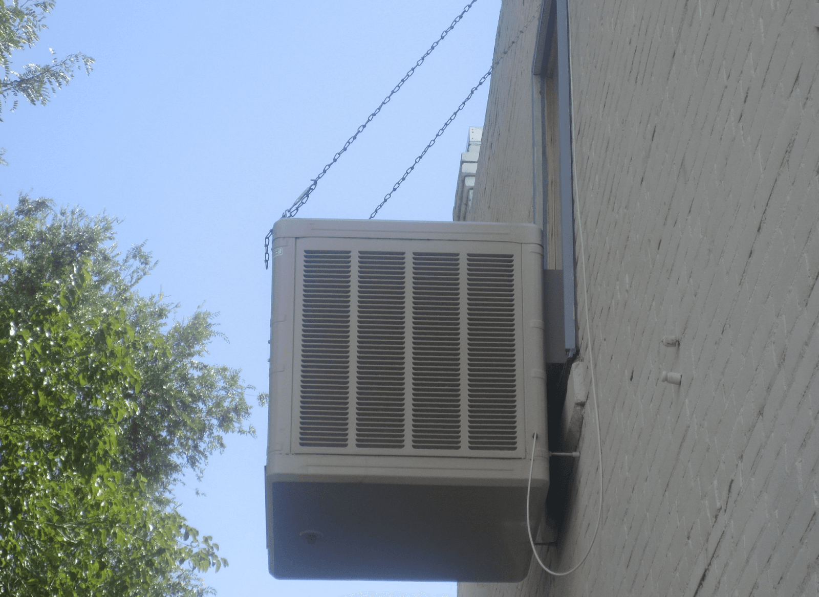 image of air conditioner attached to a building