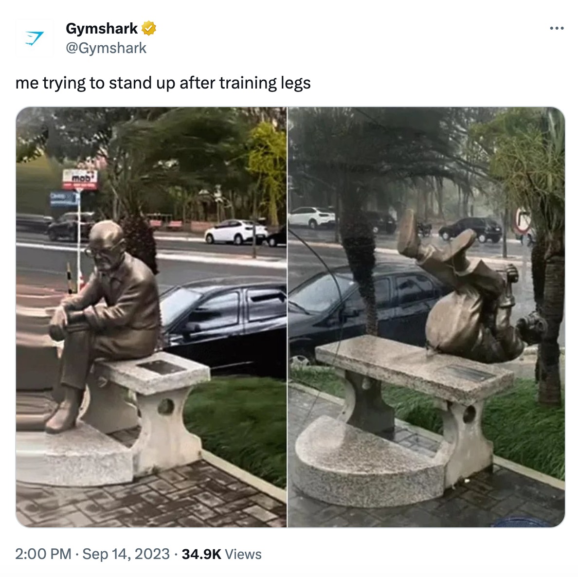 A screenshot of an X (formerly known as Twitter) post from GymShark. The text in the post reads, “me trying to stand up after training legs”. The post includes two images: one of a statue of a man sitting down, and another of that same statue toppling over. 