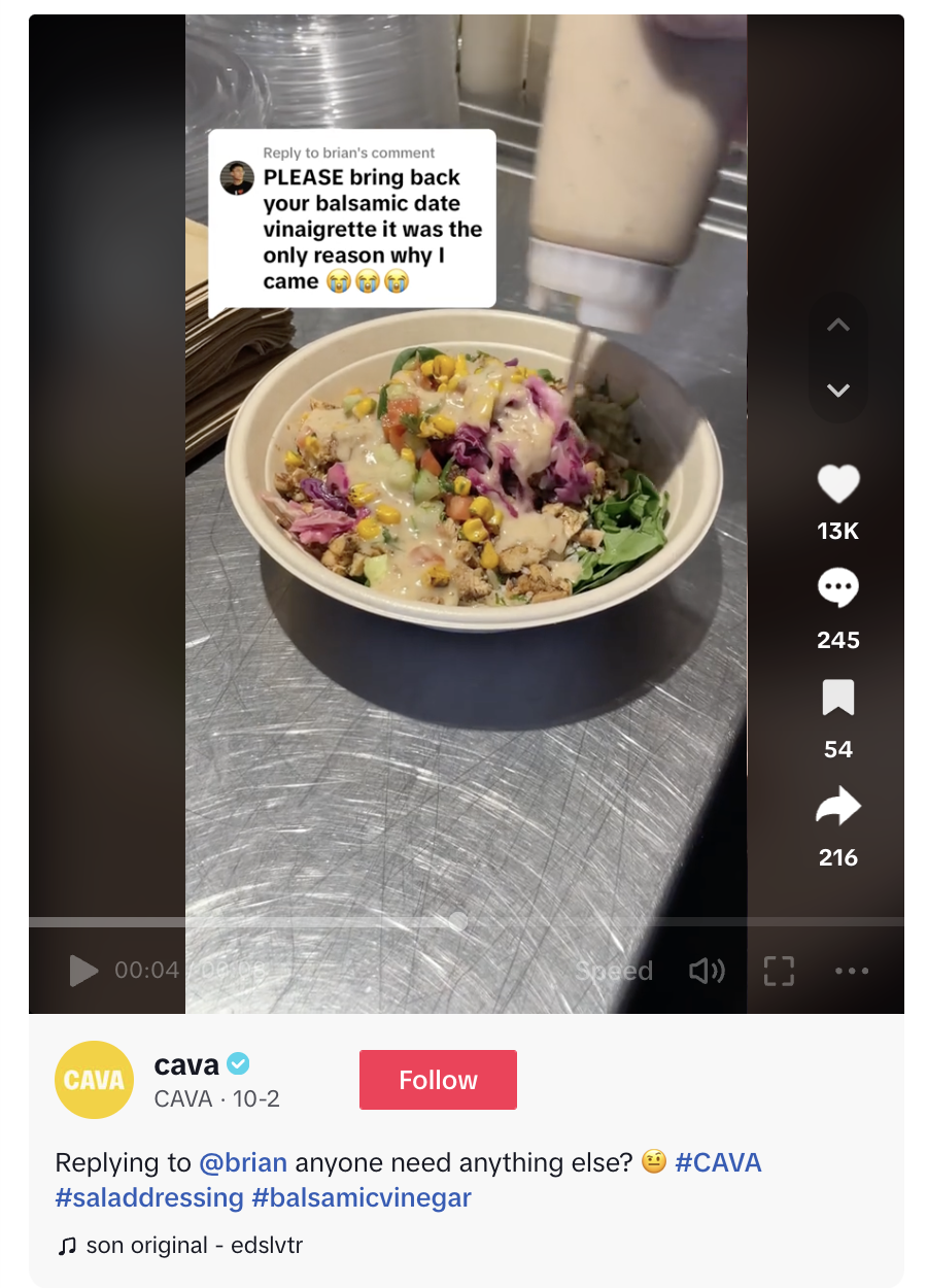 A video comment on TikTok from Cava responding to a customer asking the franchise to bring back balsamic date vinaigrette. The video shows a bowl being made with the vinaigrette.