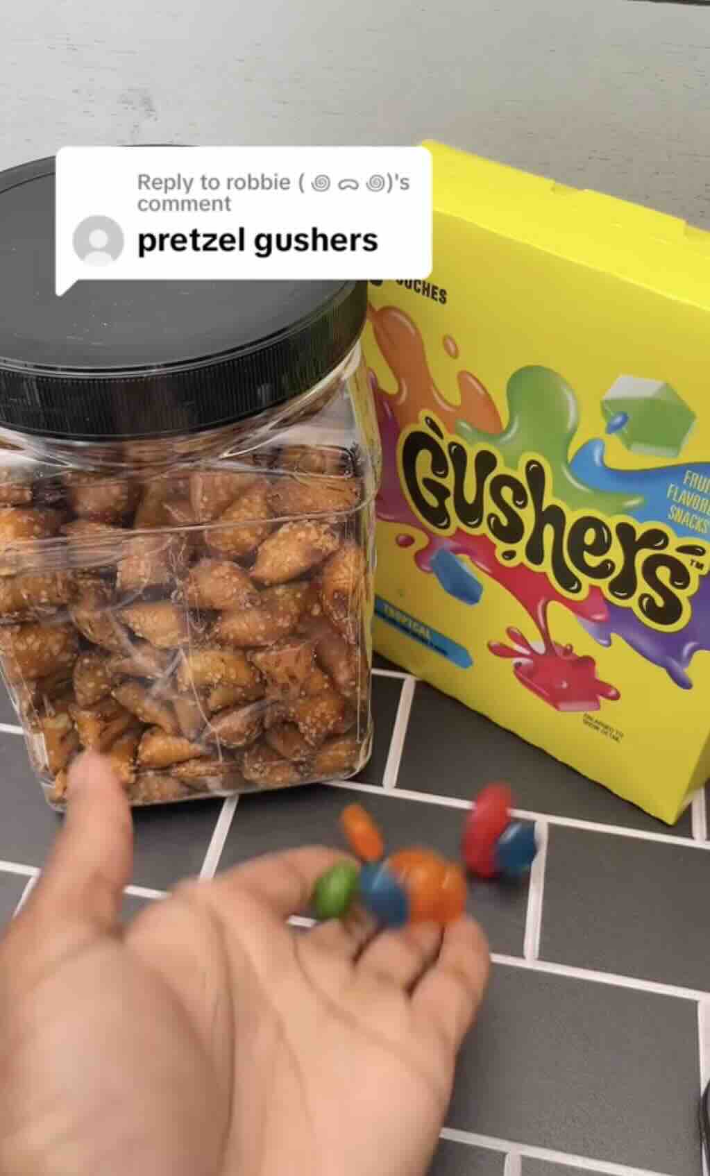 A screenshot of Gusher's TikTok video response to someone requesting pretzels to be eaten with Gushers in the comments of a previous Gusher TikTok video