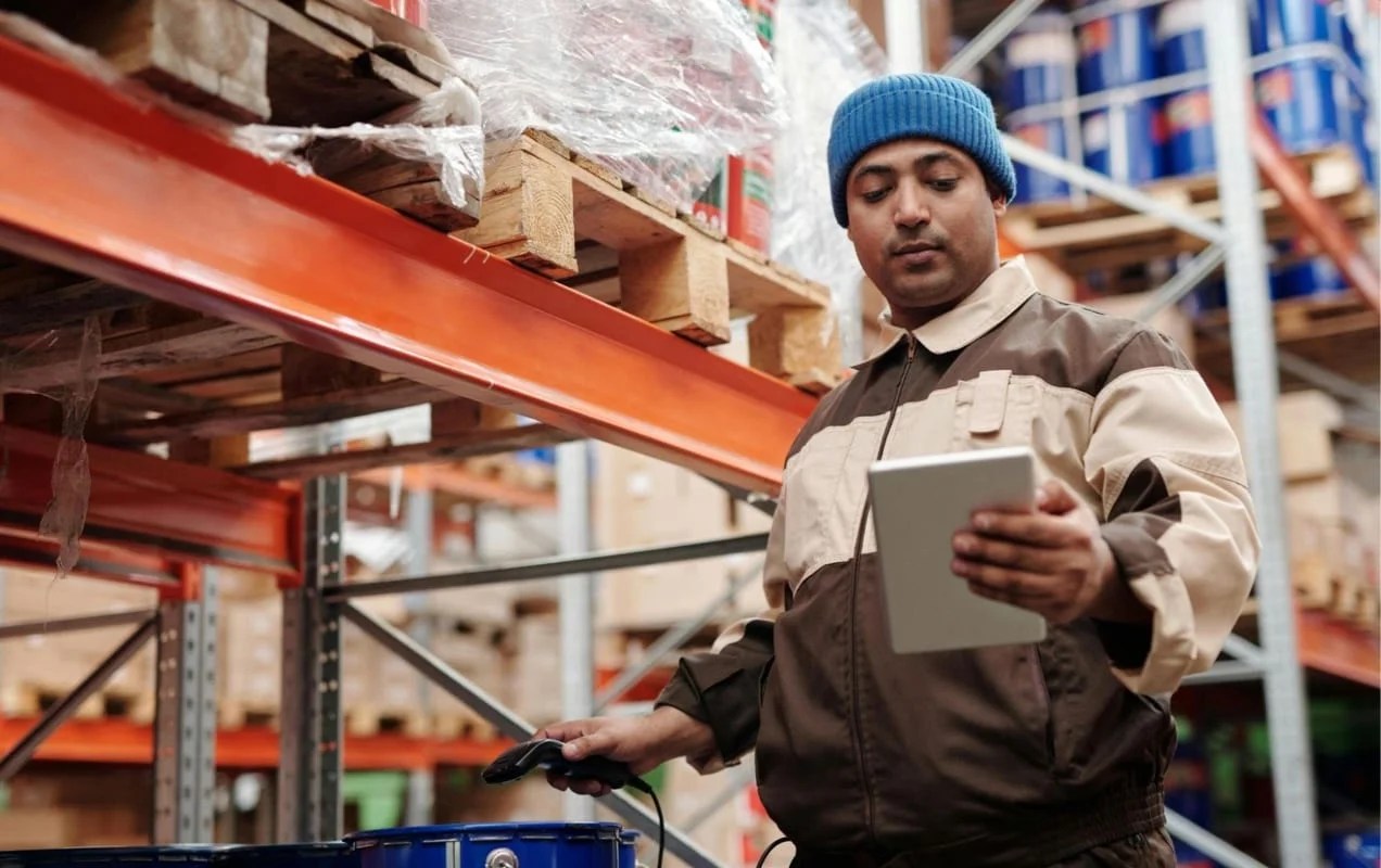 man scanning items into an inventory management system