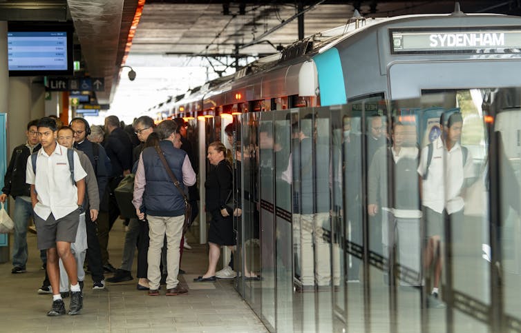 People exiting a train.